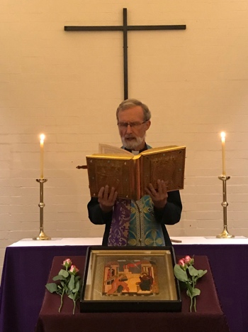 Fr. Geoff reads the Gospel during the Akathist