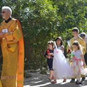 Children march in the Triumphal Entry