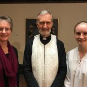 Fr. Geoff with the baptismal candidate and her god-mother