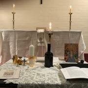 The table of preparation (foreground) and the altar (background) in the small chapel