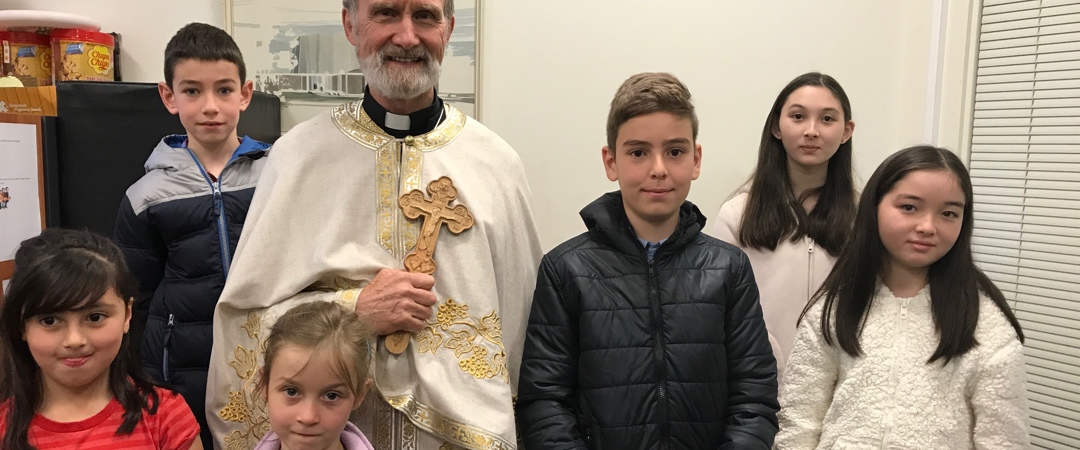 Fr. Geoff with Sunday School children