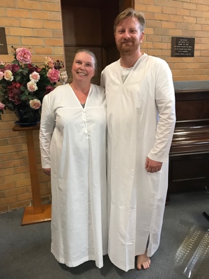 A husband and wife preparing for baptism