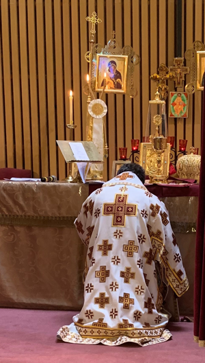 Kneeling in Prayer before the Altar