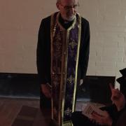 Fr. Geoff greeting a congregant