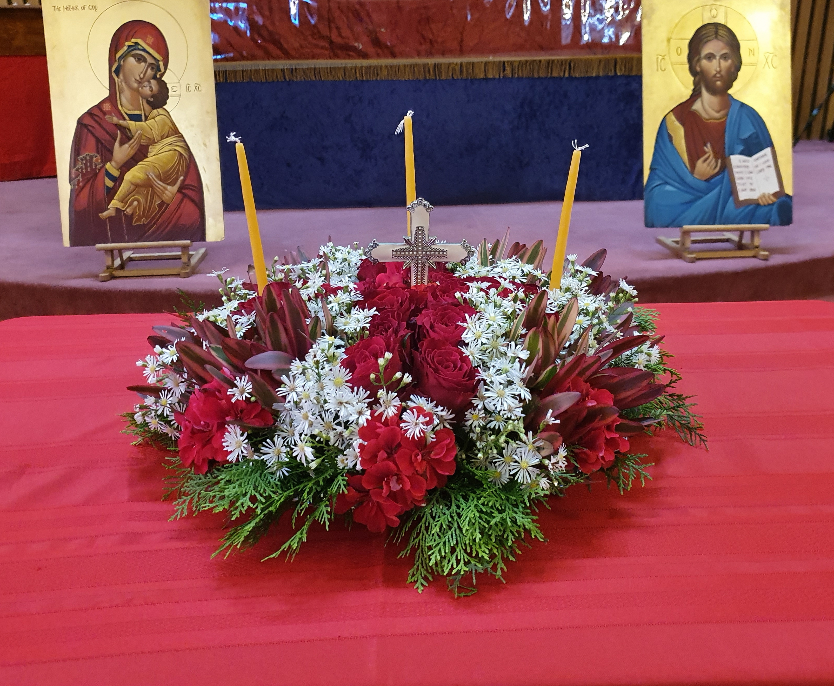 Photo of the Holy Cross flower decoration featured in the Divine Liturgy today